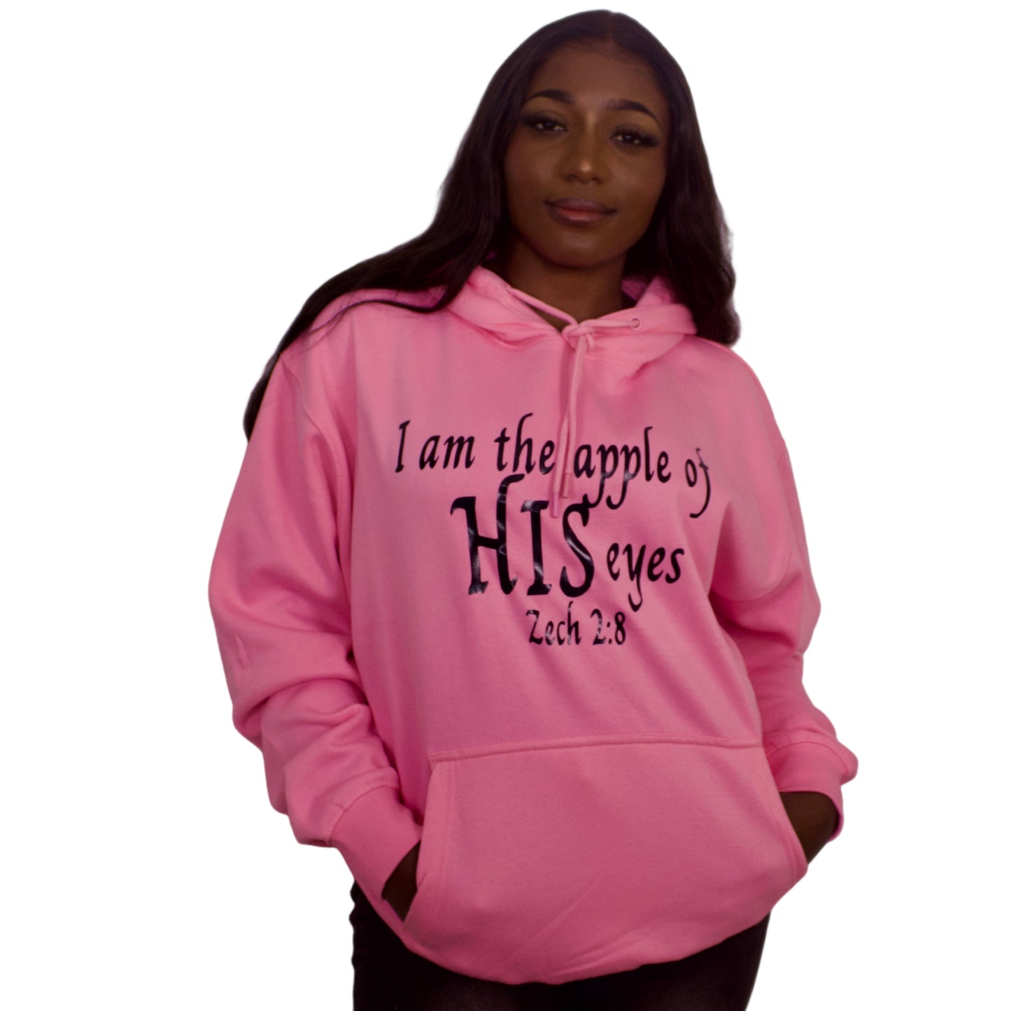 Person wearing a pink hoodie with text against a plain background