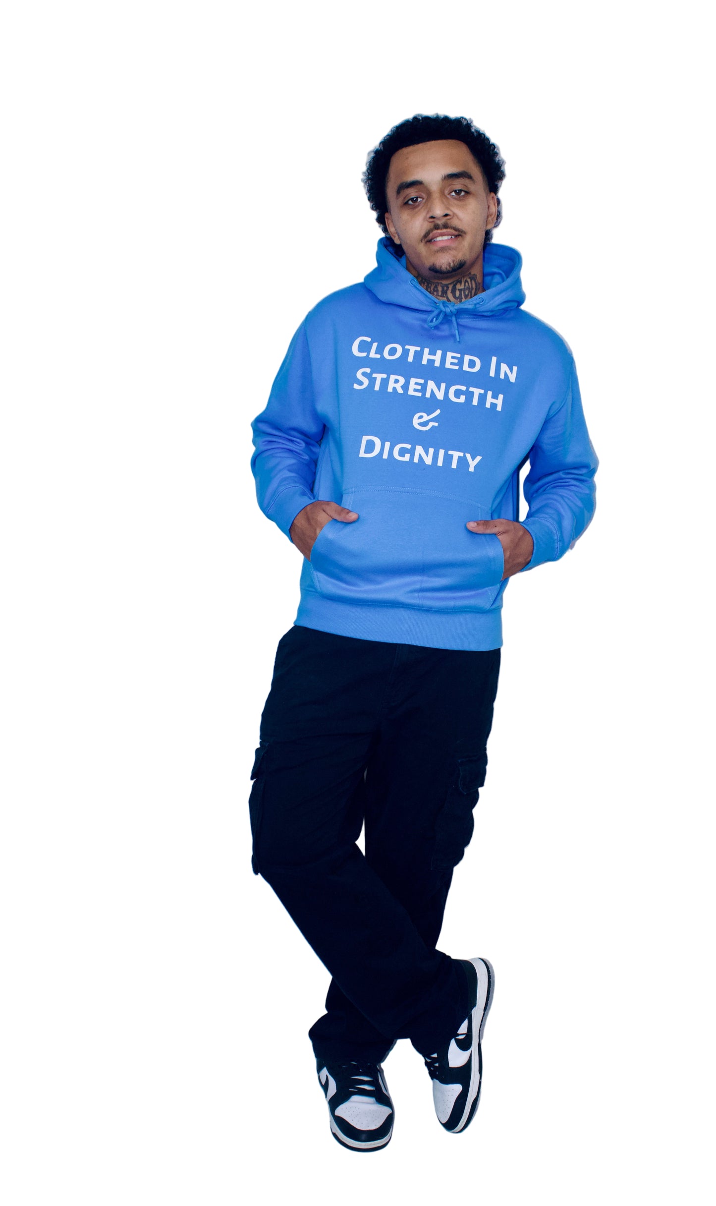 Person wearing a blue hoodie with text, standing against a plain background
