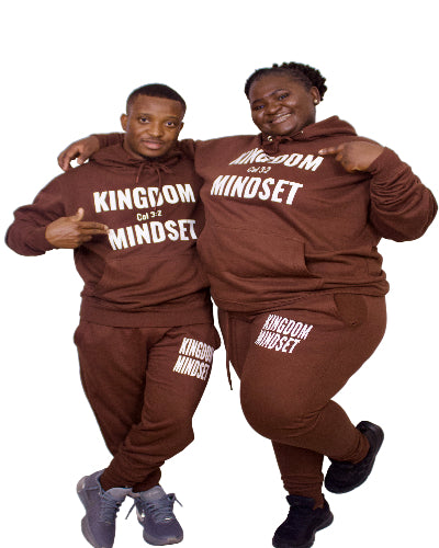Two people wearing matching brown outfits with visible text on a white background