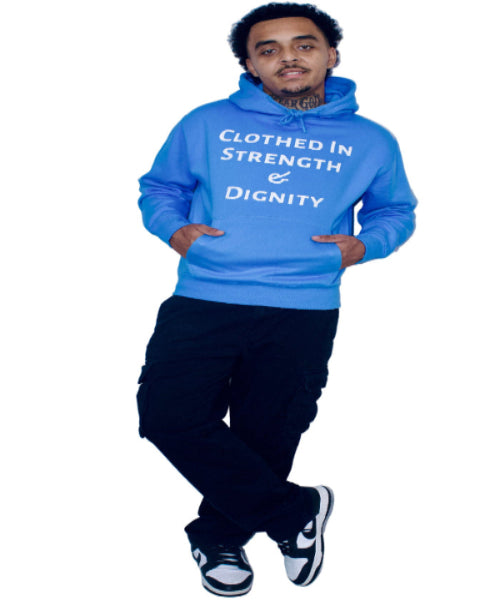 Person wearing a blue hoodie with text, standing against a plain background
