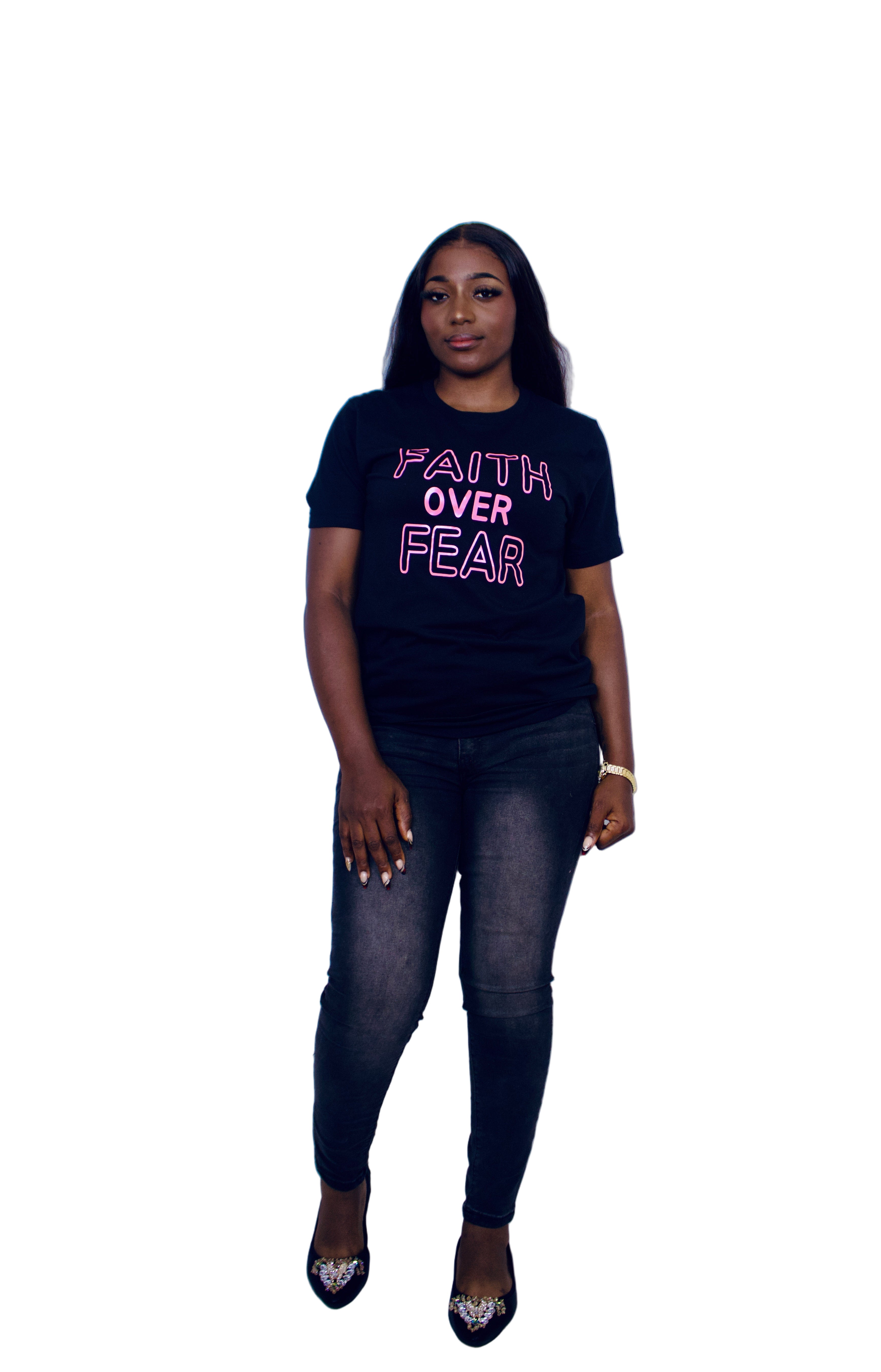 Person wearing a black t-shirt with 'Faith Over Fear' text on a white background