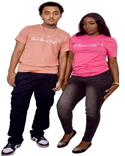 Two people wearing matching t-shirts with text on a plain background