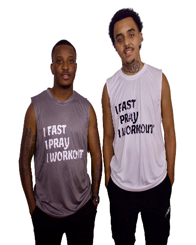 Two men wearing sleeveless shirts with motivational phrases on a plain background
