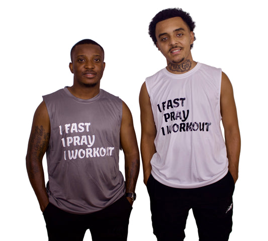 Two men wearing sleeveless shirts with motivational phrases on a plain background
