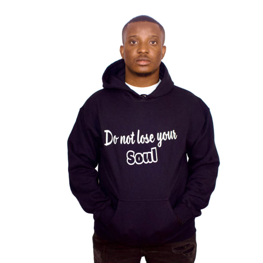 Person wearing a black hoodie with 'Do not lose your Soul' text on a white background